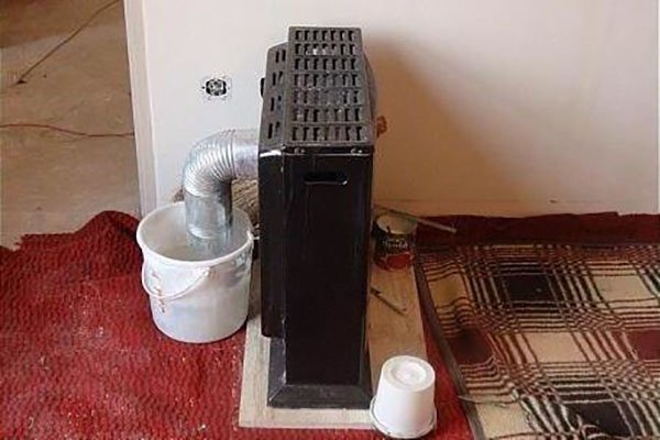 Placing the chimney in the bucket of water